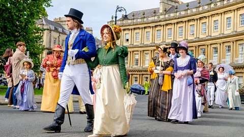 Alamy People walking in Regency-era costumes (Credit: Alamy)