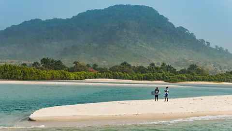 Alamy Two people on a beach in Sierra Leone (Credit: Alamy)