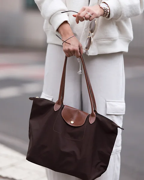 Getty Images Longchamp's practical Le Pliage is lightweight, roomy and foldable – and is a favourite with Gen Z (Credit: Getty Images)