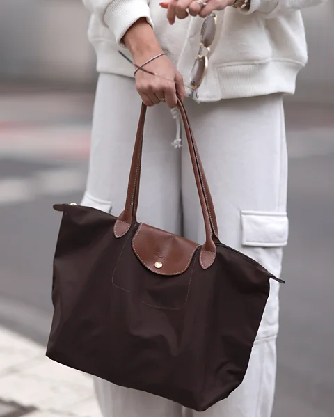 Getty Images Longchamp's practical Le Pliage is lightweight, roomy and foldable – and is a favourite with Gen Z (Credit: Getty Images)