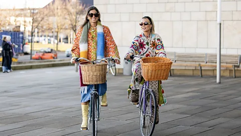 Getty Images Copenhagen Fashion Week guests showcase the layering and bright colours typical of Scandi-girl chic (Credit: Getty Images)