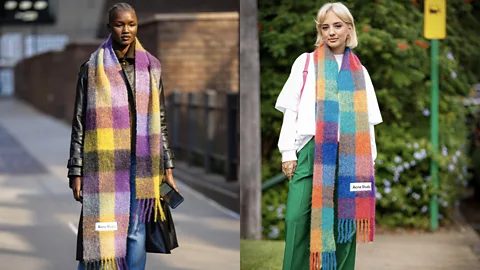 Getty Images A pop of colour can be cheering during long Nordic winters – shown here, candy-coloured checked scarves by Swedish label Acne Studios (Credit: Getty Images)