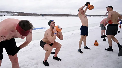 Getty Images When exercising in the cold, it’s important to wear sufficient clothing – unlike the men at the Iceman competition in Moscow in 2023 (Credit: Getty Images)