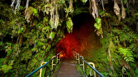 Getty Images Lava tubes are among the many geological wonders families can explore together in Hawaii (Credit: Getty Images)