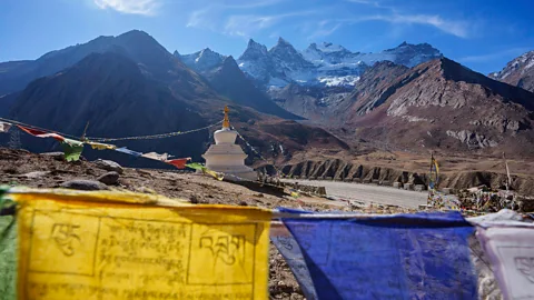 Matt Stirn Flags and a structure on a mountain in the Himalayas (Credit: Matt Stirn)