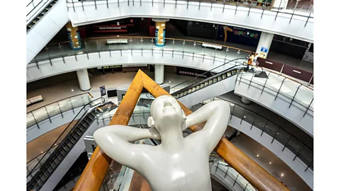 Mladen Antonov/ AFP/ Getty Images Within days, the shopping mall was almost empty – with shoppers led past closed stores to supermarkets that remained open (Credit: Mladen Antonov/ AFP/ Getty Images)