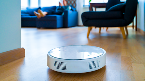 robotic vacuum cleaner working in living room