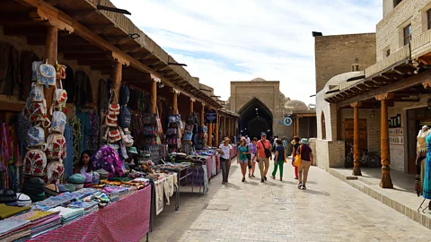 Getty Images Bukhara's bazaars are now teeming with imported, mass-produced goods (Credit: Getty Images)