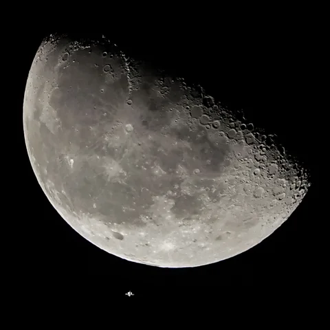 Getty Images The International Space Station, pictured here about to pass in front of the Moon, occupies the increasingly busy region of low Earth orbit (Credit: Getty Images)