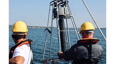 Ifremer/ Thomas Pellissier Pulling a sediment core from the Etang de Thau, a saltwater lagoon in the South of France (Credit: Ifremer/ Thomas Pellissier)