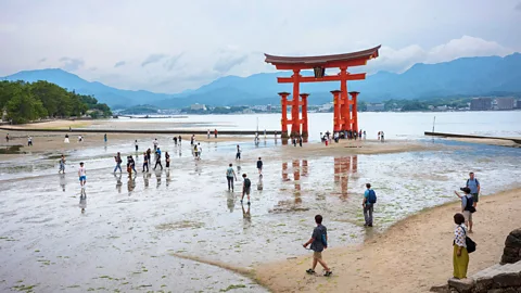 Alamy Particles of debris created when the US dropped an atomic bomb on Hiroshima, Japan, mingle with the sand on nearby beaches.