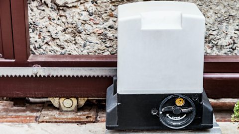 The mechanism of an electric gate showing the toothed rack