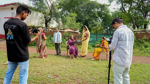 Suhail Bhat Villagers in Tulsi often take a break from their daily activities to get involved in the filming of videos (Credit: Suhail Bhat)