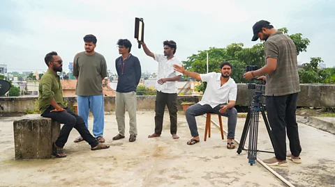 Suhail Bhat Aditya Bhagel (second from the right) goes through a scene with his actors and crew before they begin filming in the village (Credit: Suhail Bhat)