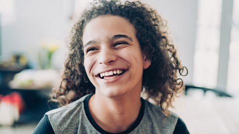 Curly hair teen smiling