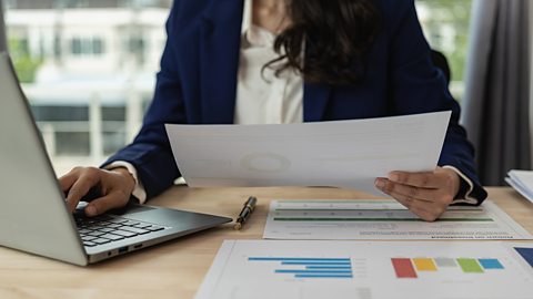 Business woman calculating her cash flow forecast