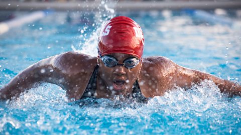 Female swimmer at a swim competition.
