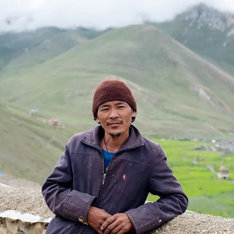 Eileen McDougall Rinchen Lama farms livestock in the wild mountain landscape of Nepal's Dolpa region in the high Himalaya and has lost livestock to snow leopard attacks (Credit: Eileen McDougall)