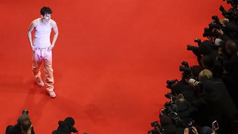 Getty Images Chalamet's awards campaign has seen the actor sport eye-catching outfits like this pink number at the Berlin Film Festival (Credit: Getty Images)