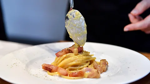 Getty Images Carbonara is another controversial dish, with the "authentic recipe" including pork jowl and Roman pecorino cheese – and no cream (Credit: Getty Images)