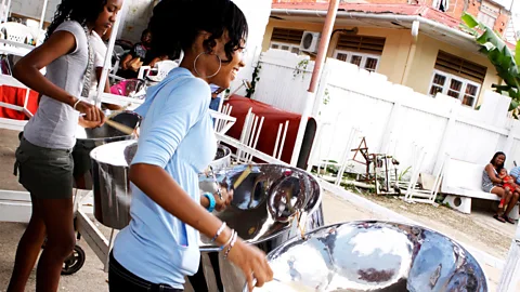 Getty Images Panyards are a communal rehearsal space for local steelpan bands, and music-loving visitors can drop by any time (Credit: Getty Images)