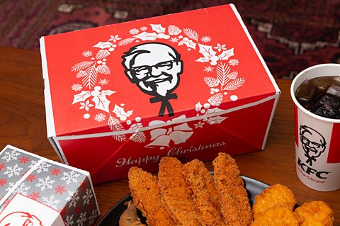KFC Christmas meal boxes, food and soft drink are pictured on a table in Tokyo, Japan