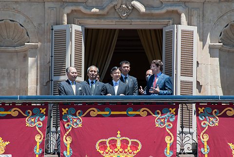 Japan's Crown Prince Naruhito waves to the crowd from the balcony of Salamanca's town hall
