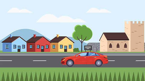 An illustration of a red car driving through a town
