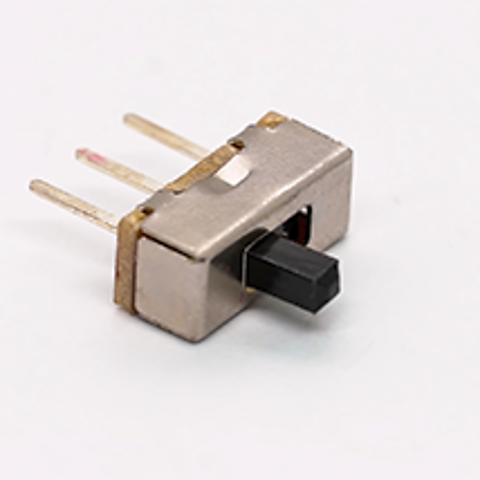 Single pole, double throw slide switch on white background