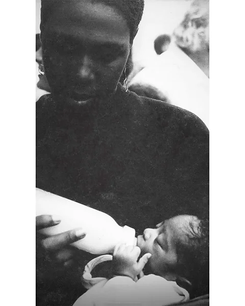 FX Afeni feeding Tupac as a baby – the song pays tribute to her care and sacrifices for her children, despite her troubles (Credit: FX)