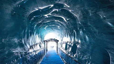 Alamy The Mer de Glace ice cave has to be dug out each summer since the glacier shifts as much as 70m every year (Credit: Alamy)