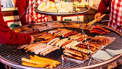 Bratwurst sausages grilled at Christmas Market, Berlin, Germany.