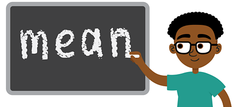 A boy using a piece of chalk to write the word 'mean' on a board.