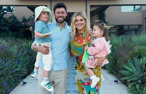 Ashley James with her partner, son Alfie and daughter Ada standing outside building