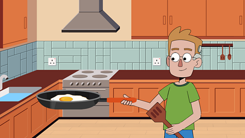 An illustration of a boy in a kitchen using a frying pan to make a fried egg