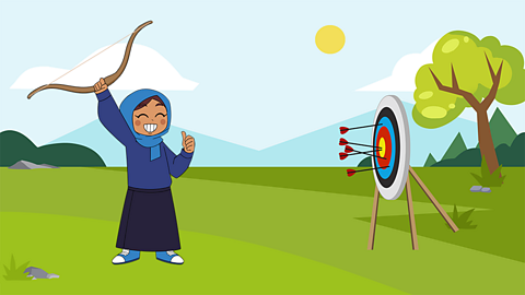 A young girl firing arrows into target in a field reasonably accurately it has to be said