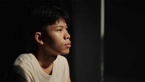 Male teenager looking sad and contemplative