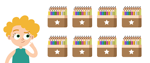 Jamie holding a big box of pencils.