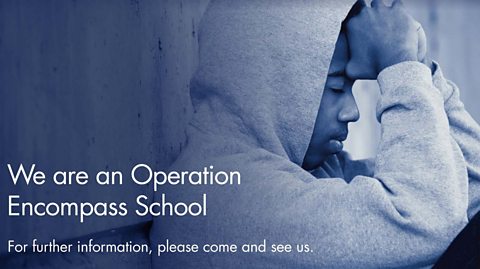 A young man with his head in his hands