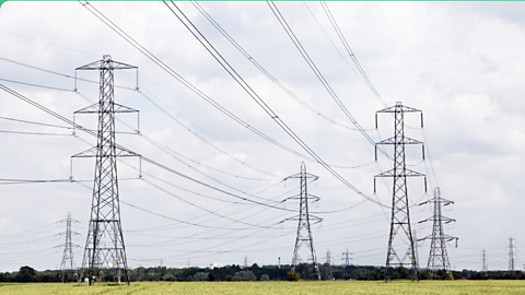 Four electricity pylons with overhead cables