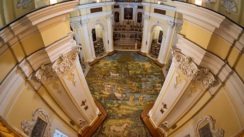 Getty Images Anacapri is also home to unique cultural treasures like the baroque Chiesa di San Michele Arcangelo with its exquisite majolica floor (Credit: Getty Images)