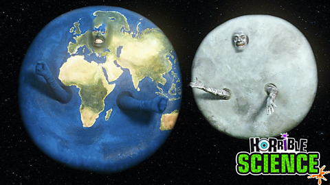 Two people dressed up as The Earth and The Moon 