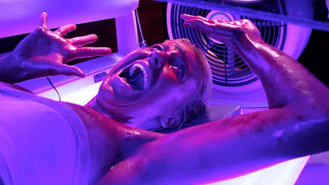 Alamy The franchise places characters in everyday situations turned nightmarish, such as a visit to a tanning salon (Credit: Alamy)