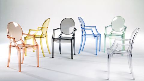 Six translucent Louis Ghost chairs designed by Philippe Starck in a range of colours
