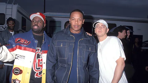 Alamy Eminem (right) with Dr Dre (centre), who produced and mixed much of The Marshall Mathers LP (Credit: Alamy)