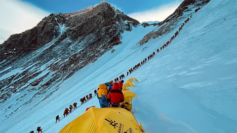 Getty Images Sherpas help hundreds of climbers reach the top of Mount Everest each year (Credit: Getty Images)