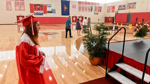 Getty Images Even important milestones such as graduations were disrupted, although some schools went ahead with the ceremonies in different ways (Credit: Getty Images)