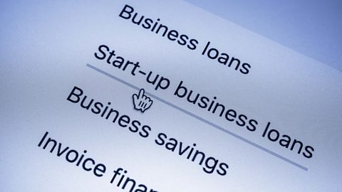 A web cursor clicking on a weblink saying Start-up business loans