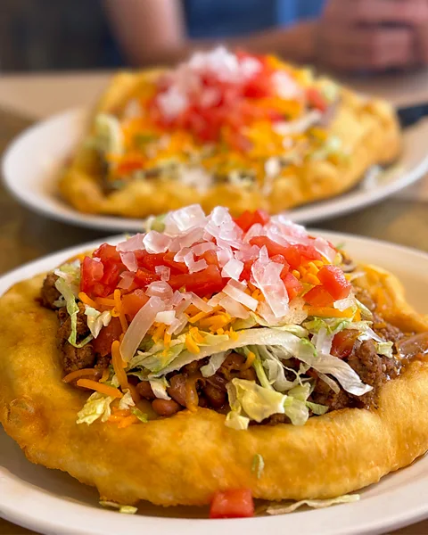 Getty Images Navajo tacos are a twist on the Mexican favourite, using Indian fry bread instead of tortillas (Credit: Getty Images)