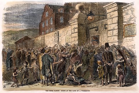 Engraving showing crowds outside a workhouse during the Irish Famine.